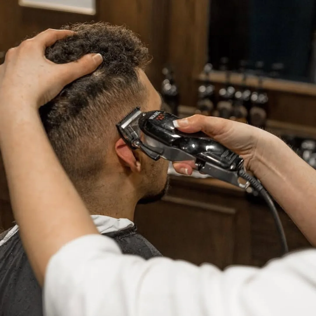 Capelli Student Working in BarberShop